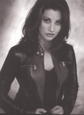   (Gina Gershon)